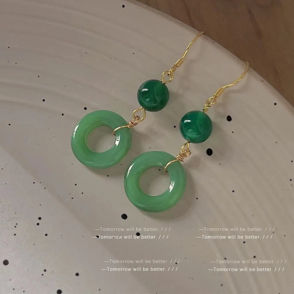 Green jade design peace buckle earrings with 14K gold plating on zinc alloy
