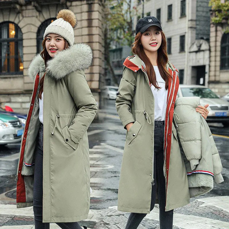 Women's long beige fleece trench coat with a belt, shown on a model.