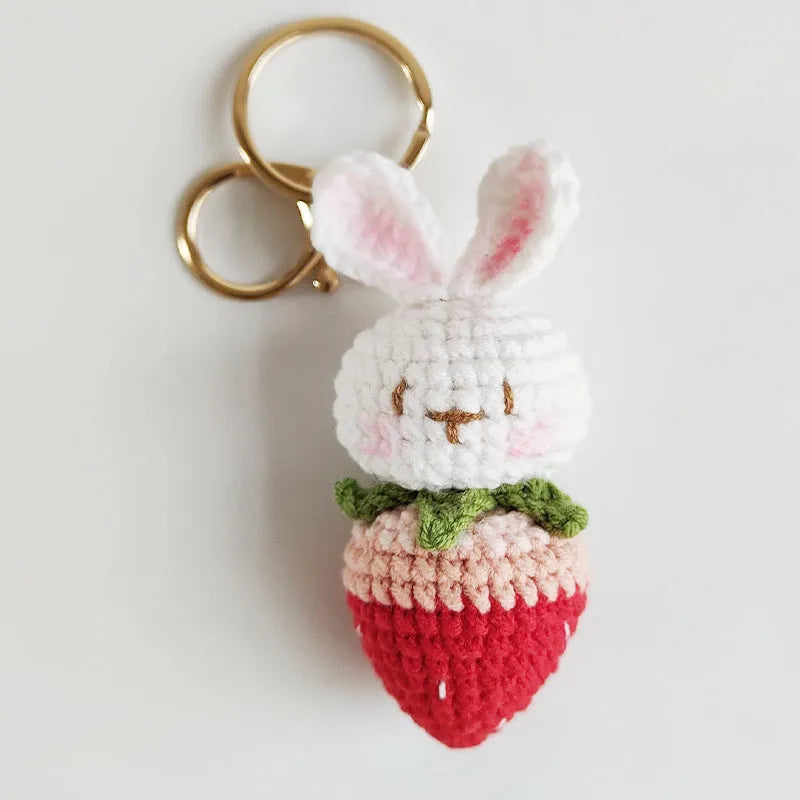 White hand-woven rabbit strawberry pendant on key with cartoon-style wire construction
