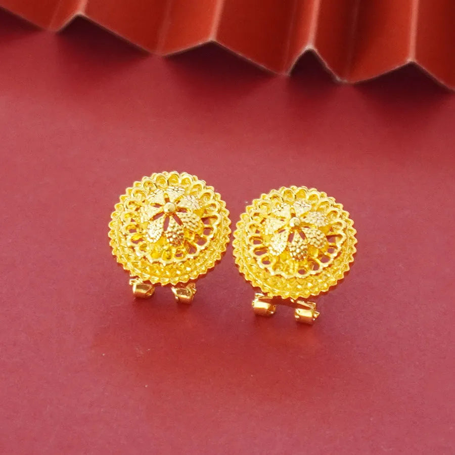 Gold-plated three-piece jewellery suit with landscape Middle East flower designs showing earrings, ring and pendant necklace