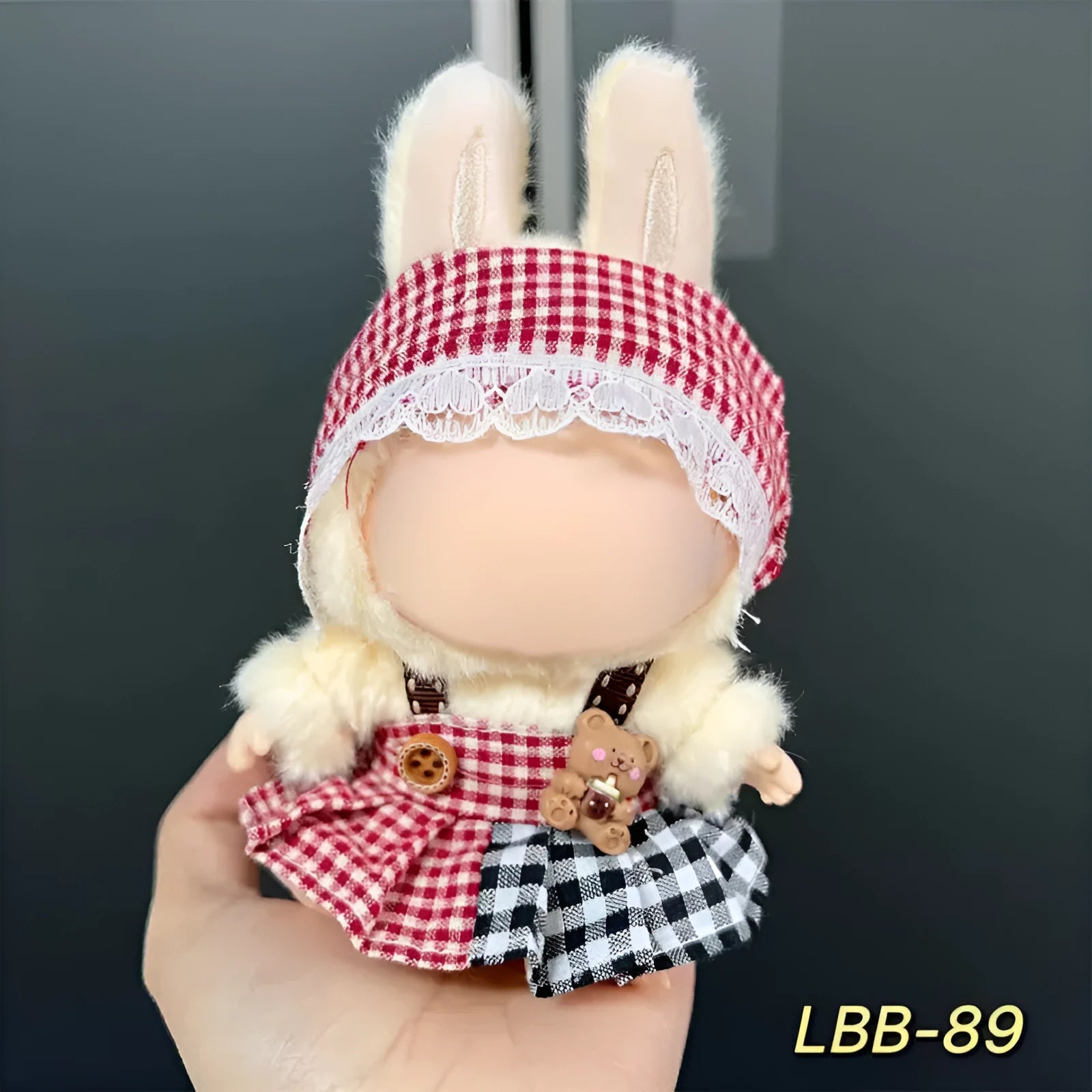 A plastic doll costume outfit for a 17cm tall vinyl figurine on a white background.