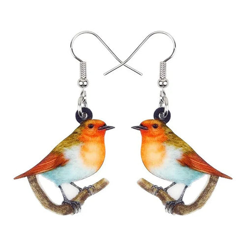 Blue Titmouse bird pendant acrylic earrings with geometric shapes and snake zodiac motifs.