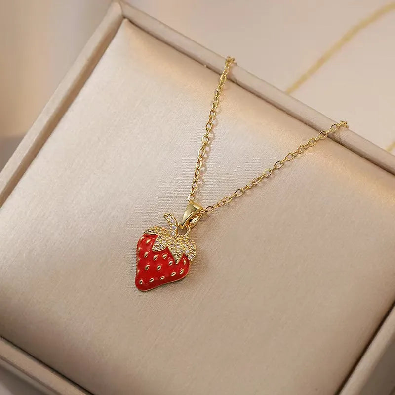 Women's titanium steel necklace with O-ring chain showing cherry, strawberry, and pepper charm options.