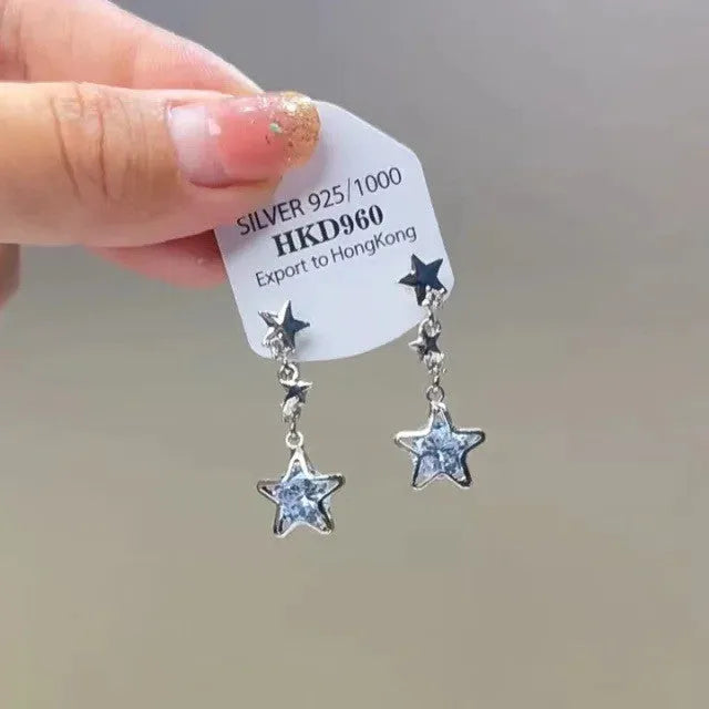 Women's geometric alloy ear clips with rhinestone decoration, star motifs, heart elements, and tassel details