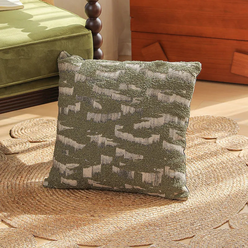 Jacquard floral pattern cushion cover in a retro colour, 45cm square, on a sofa.