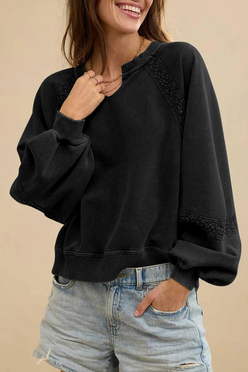 Women's loose fit long sleeve sweater with half-open collar and lace stitching detail in apricot colour.