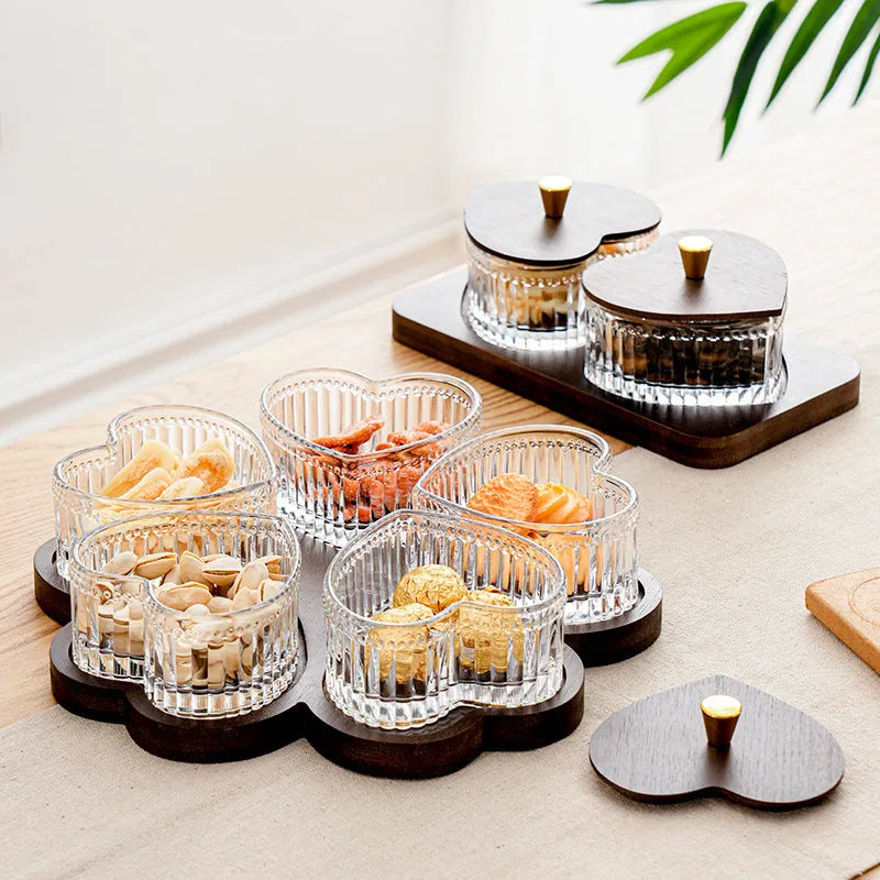 Glass retro-style snack platter with coloured glaze and a transparent heart-shaped lid over multiple compartments.