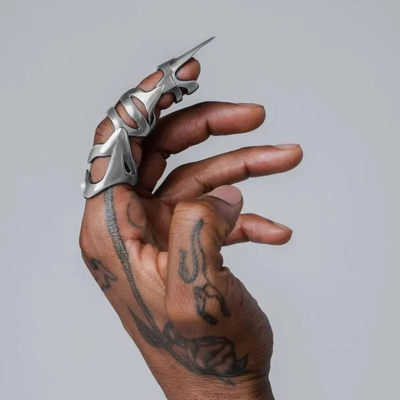 Silver alloy punk armour finger ring with stall design on model hand