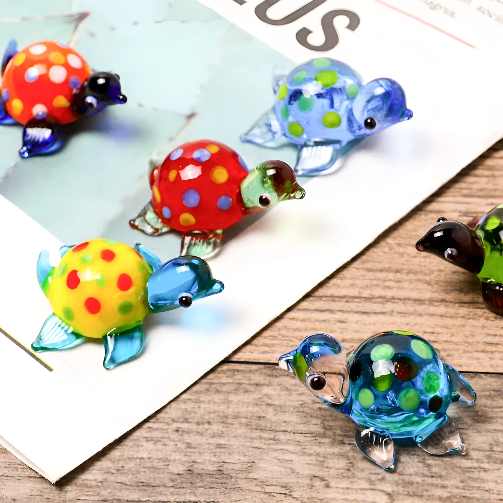Geometric glass turtle desktop ornament in modern simplicity style on a wooden surface.