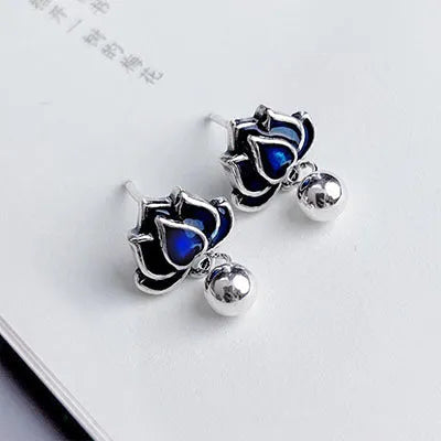 Blue lotus flower ear studs with seedpod tassels measuring 1.2cm wide
