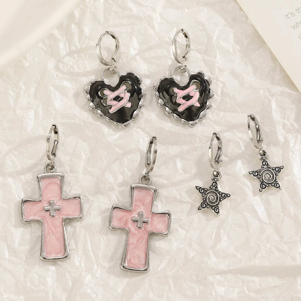 Women's alloy cross crystal earrings in five designs: white cross, peach heart, black cat, antique silver star.