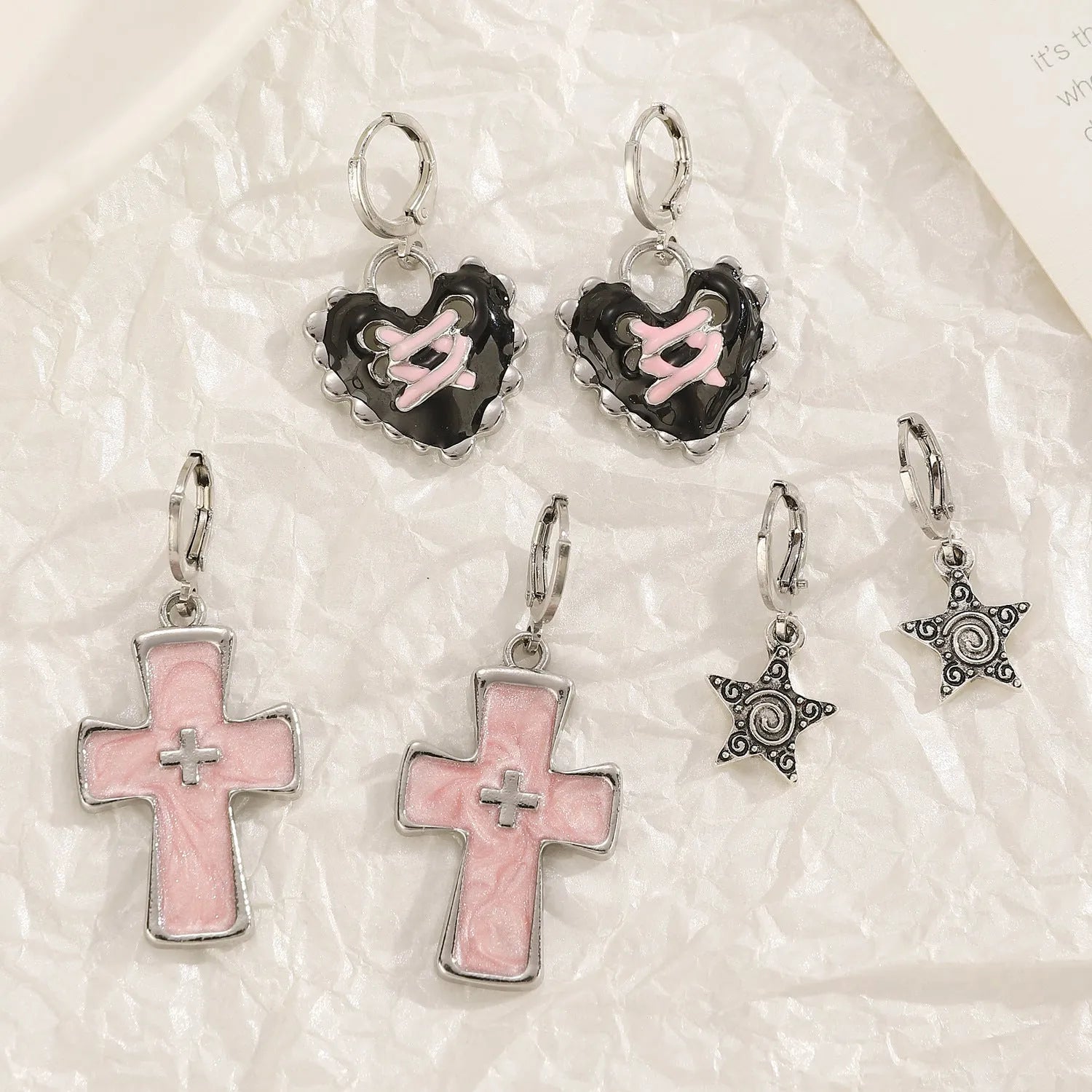 Women's alloy cross crystal earrings in five designs: white cross, peach heart, black cat, antique silver star.