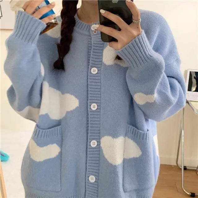 Blue cloud pattern women's loose cardigan sweater with long sleeves on hanger