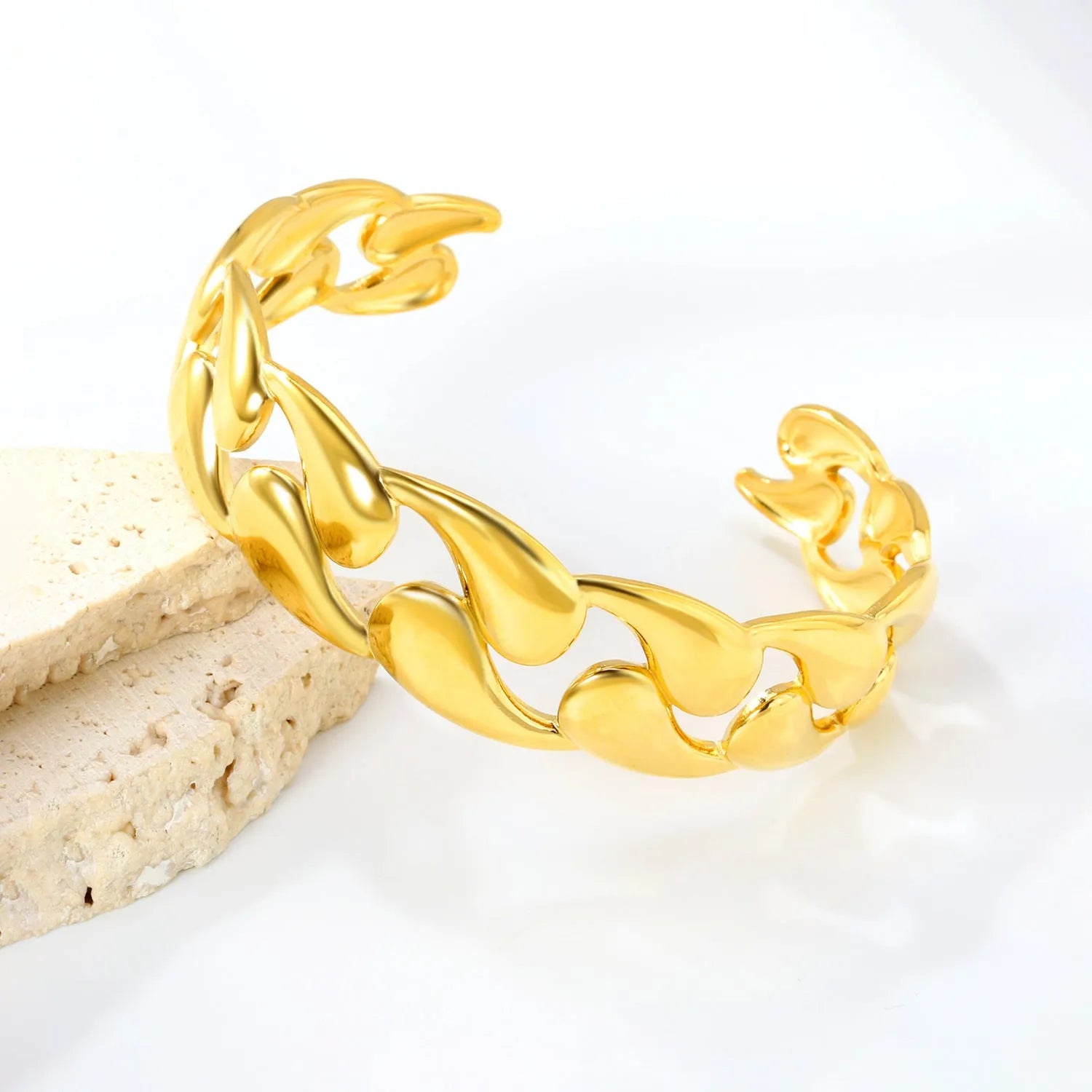 Minimalist stainless steel alloy bracelet in silver, gold, and rose gold colour options on a wrist.
