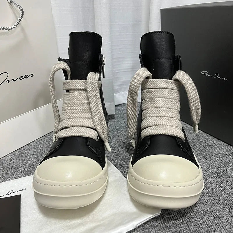 Black genuine leather high-top sneakers with side zipper and round toe on a rubber platform sole.