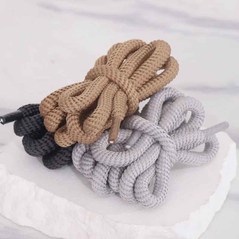 A selection of round braided shoelaces and hoodie cords in various colours, showing 1.0cm width