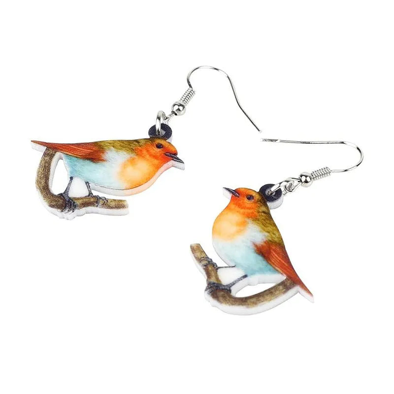 Blue Titmouse bird pendant acrylic earrings with geometric shapes and snake zodiac motifs.
