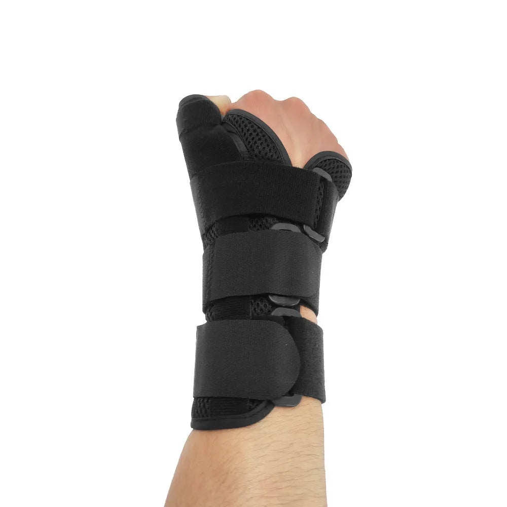 Carbon fibre sports wrist guard with thumb strap in black and grey.
