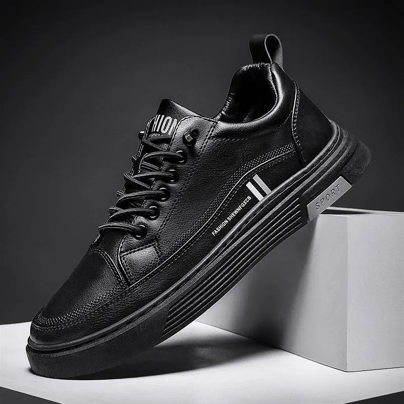 Men's white and black low-top skate shoes with an elastic band and round toe on a rubber sole.