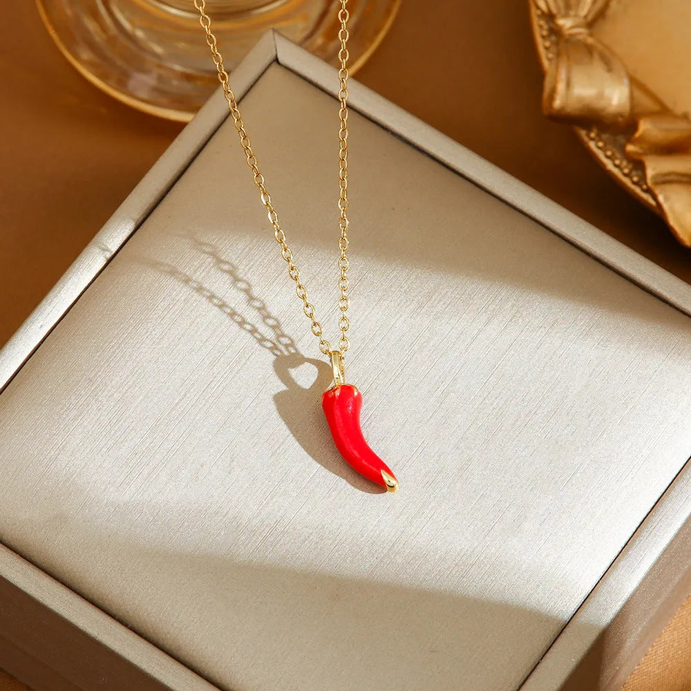 Women's titanium steel necklace with O-ring chain showing cherry, strawberry, and pepper charm options.