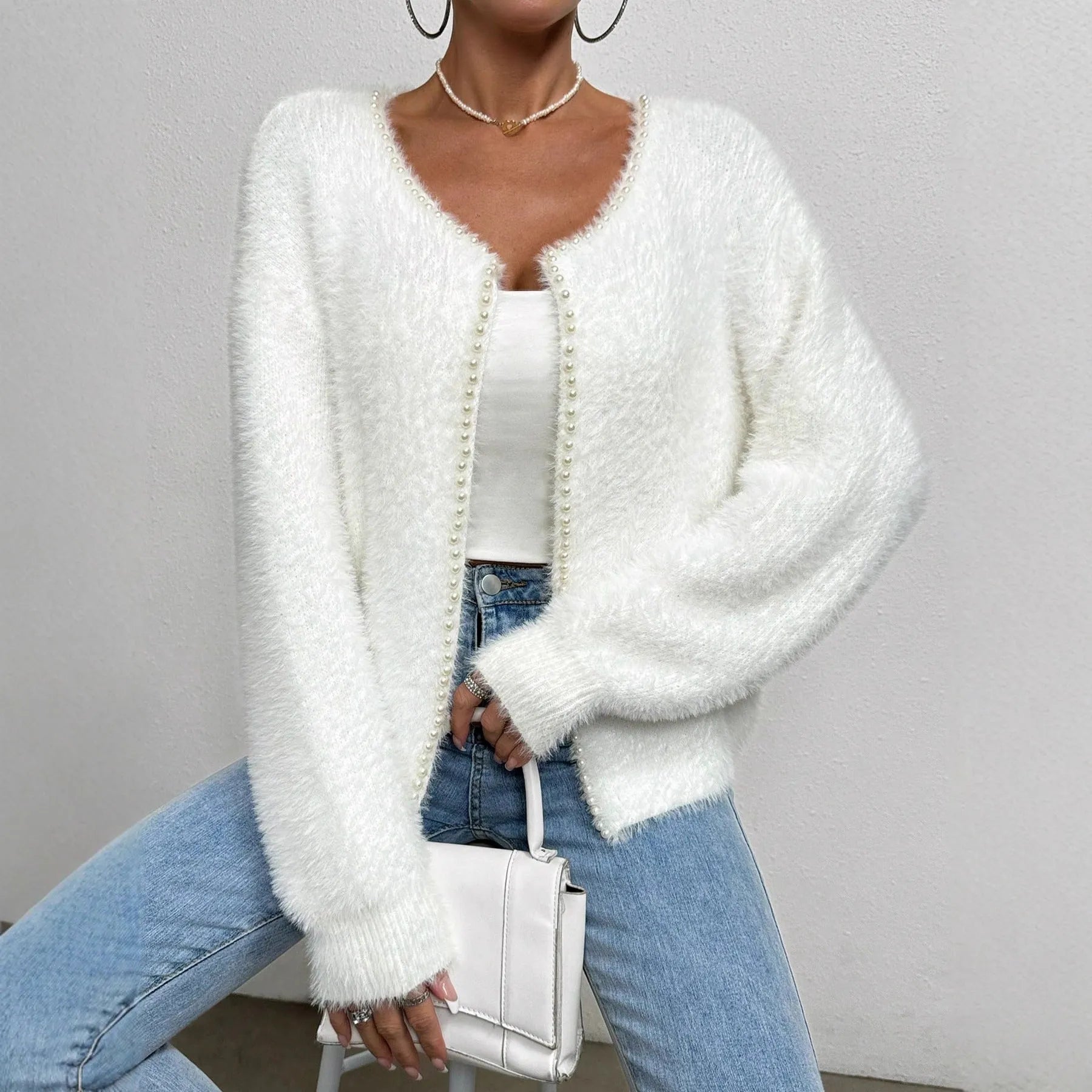 White women's V-neck cardigan with medium thickness polyester knit construction