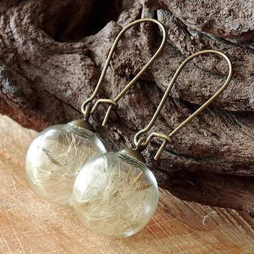 Transparent 16mm glass ball earrings with dandelion seed crystal design on silver French hooks