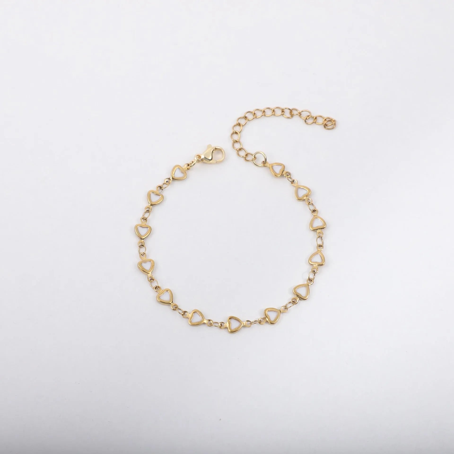 Stainless steel bracelet with heart design and gold plating in multiple colour options