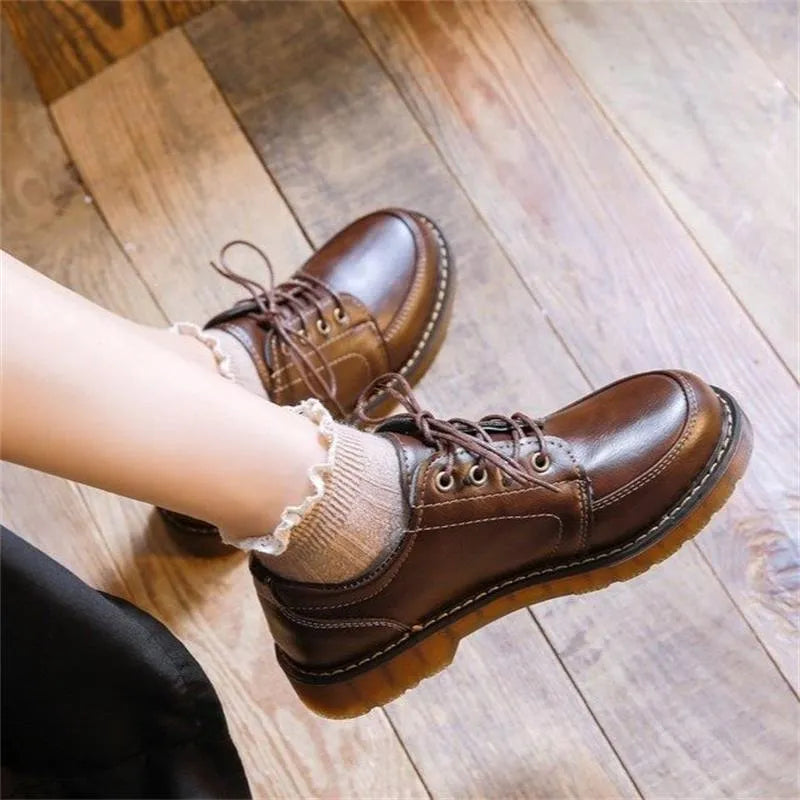 Black retro women's Mary Jane shoes with front lace-up and low square heel.
