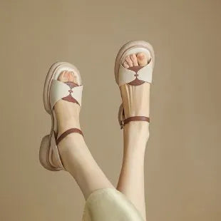 Women's beige platform sandals with chunky heel and open toe design on rubber sole