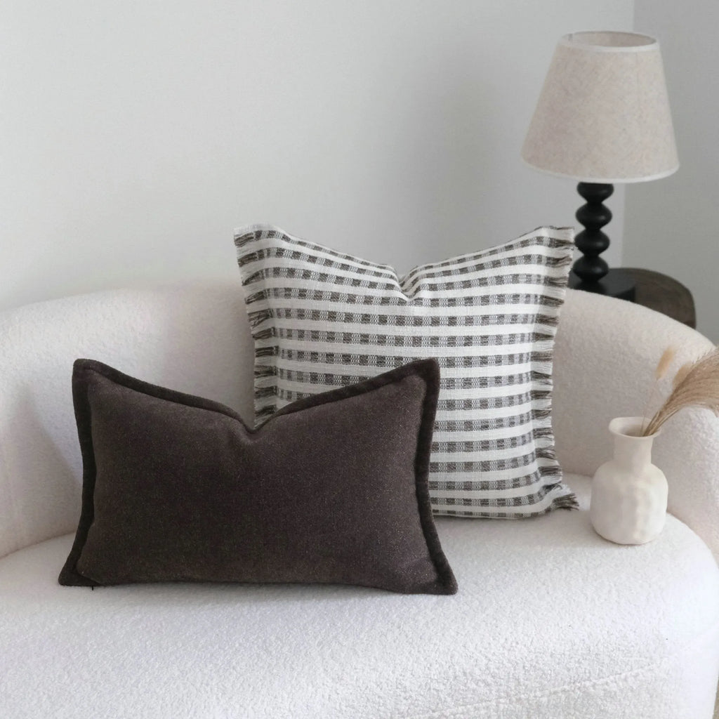 Coffee brown striped Chinese classical style decorative sofa cushion on a grey sofa.