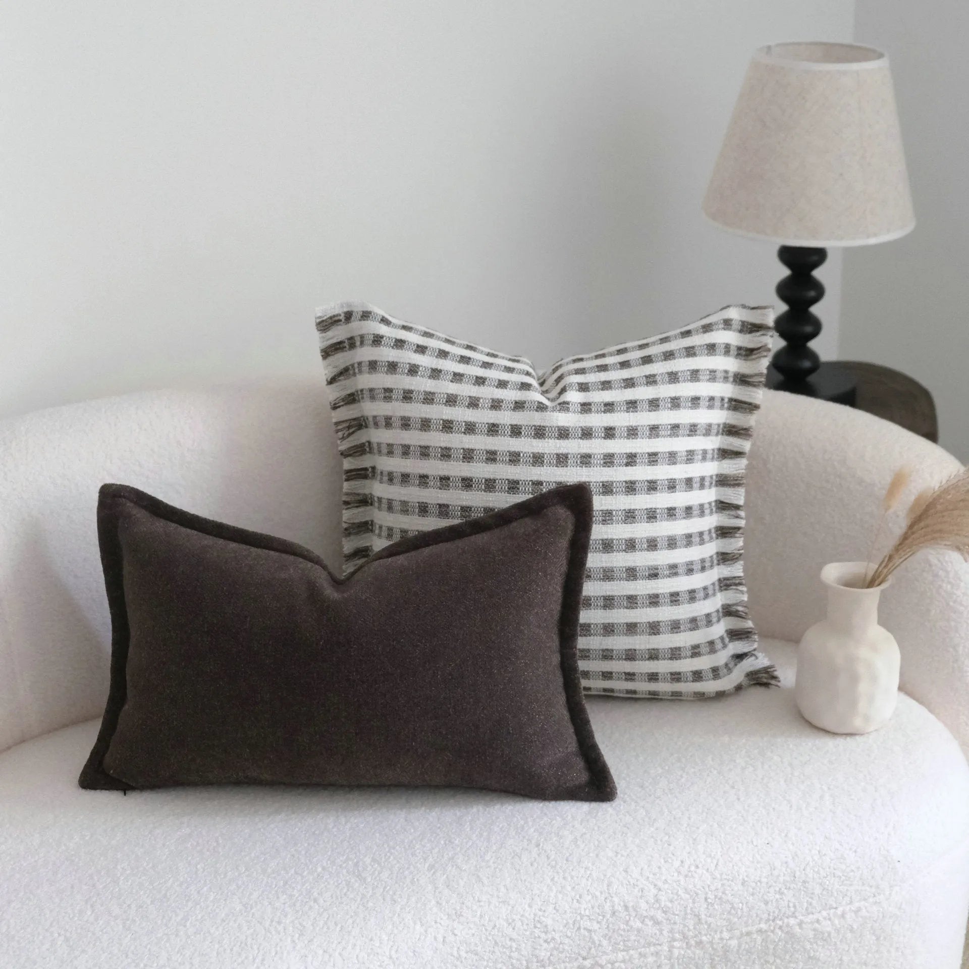 Coffee brown striped Chinese classical style decorative sofa cushion on a grey sofa.