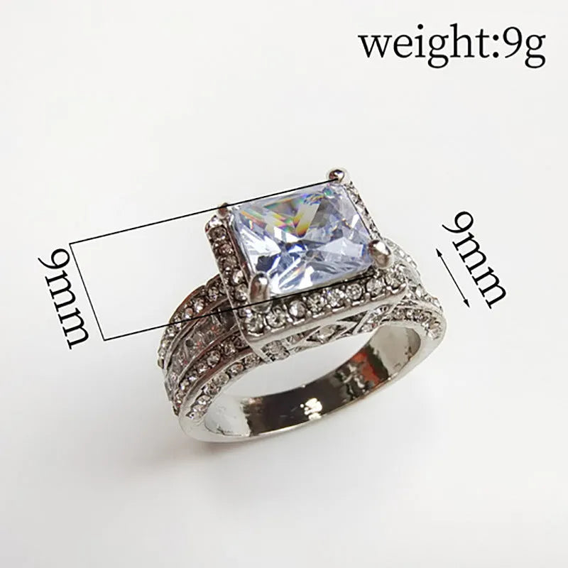 Geometric women's alloy ring in gold tone or white electroplated finish on a size guide showing UK sizes 5-13.