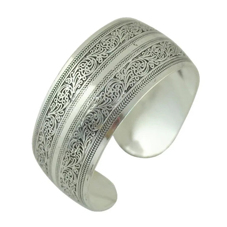 Openwork Miao ethnic carved silver bracelet with elephant or turtle motifs