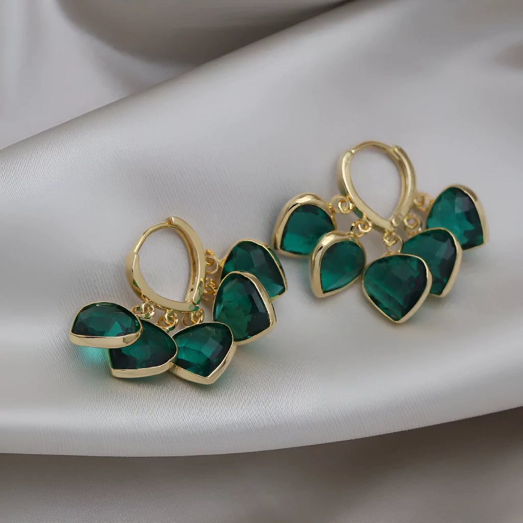 Korean style women's green heart ear clip earrings with alloy inlay gemstone.