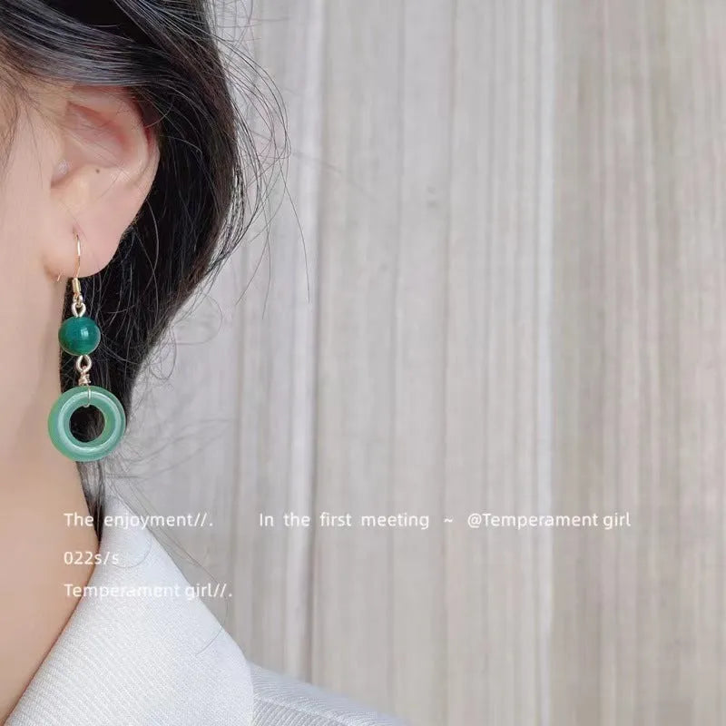 Green jade design peace buckle earrings with 14K gold plating on zinc alloy