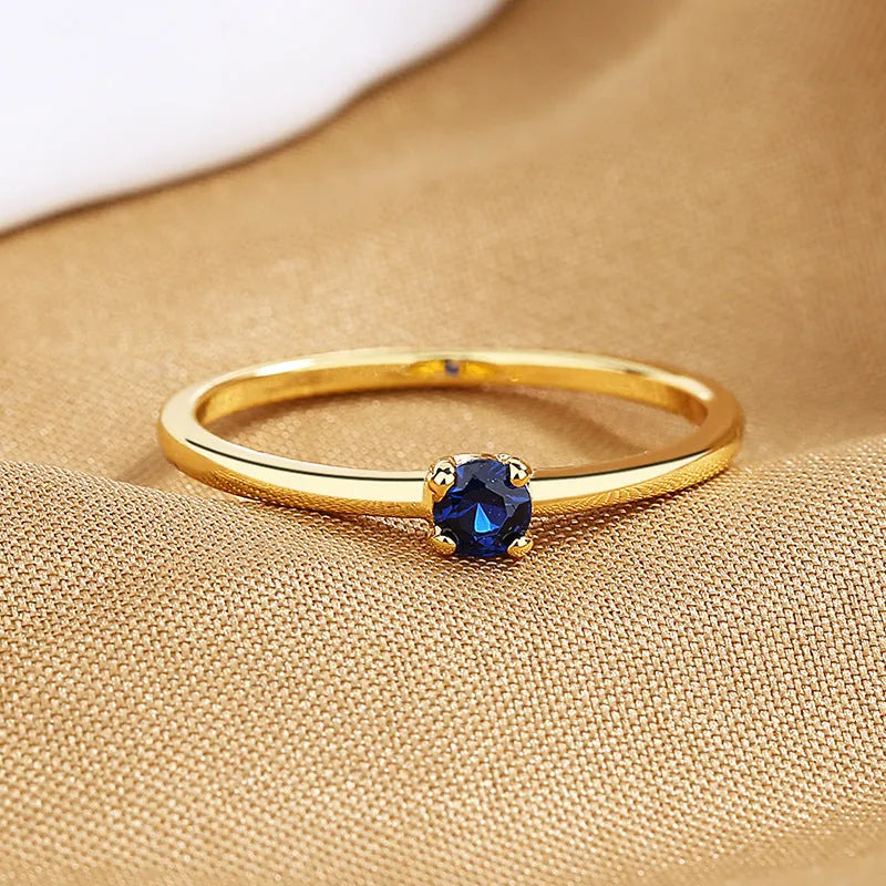 Women's copper ring with single diamond geometric design in round circle shape showing colour options