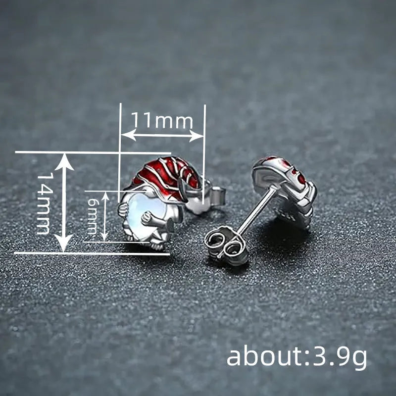 Close-up of women's heart-shaped earrings with a Santa Claus design in a white gold colour.