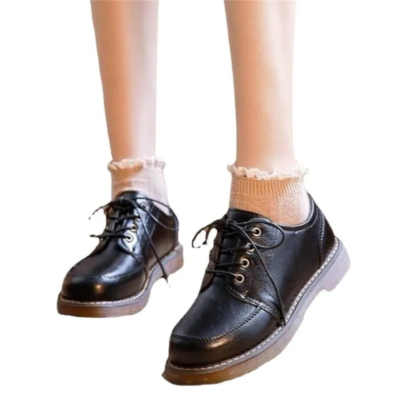 Black retro women's Mary Jane shoes with front lace-up and low square heel.