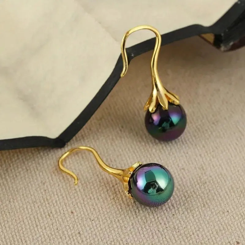 Gold electroplated alloy earrings with retro fashion design for women