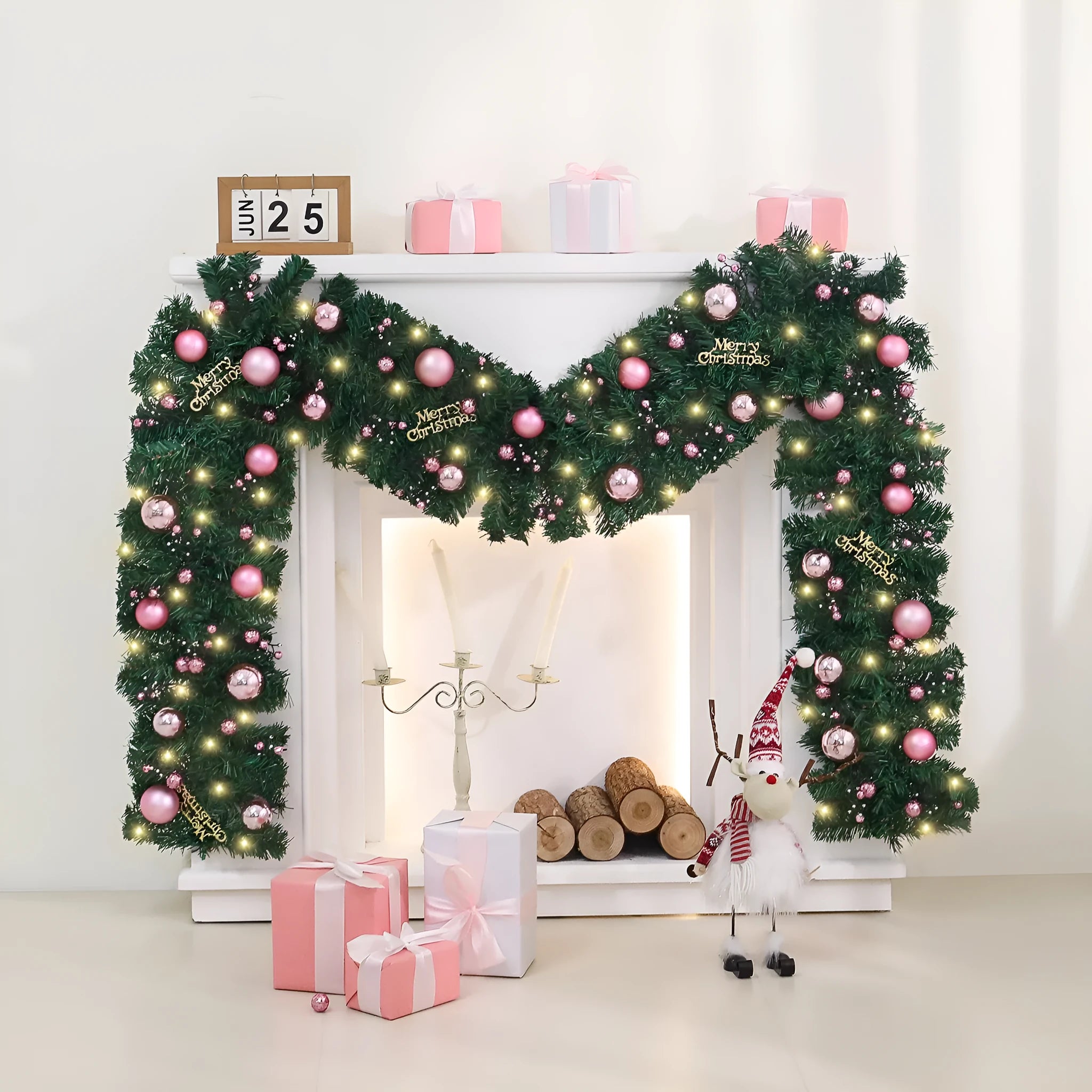 Long pink rattan Christmas garland with small fruit details and optional warm white lights draped on a mantle.