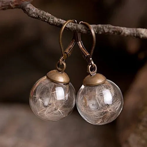 Transparent 16mm glass ball earrings with dandelion seed crystal design on silver French hooks