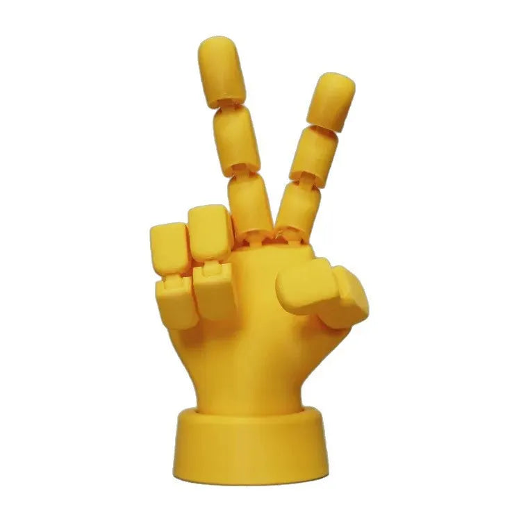 Yellow hand ornaments figurine with movable joints measuring 5 by 5.38 by 7.5 centimetres