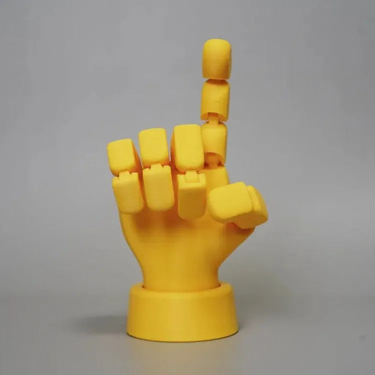 Yellow hand ornaments figurine with movable joints measuring 5 by 5.38 by 7.5 centimetres