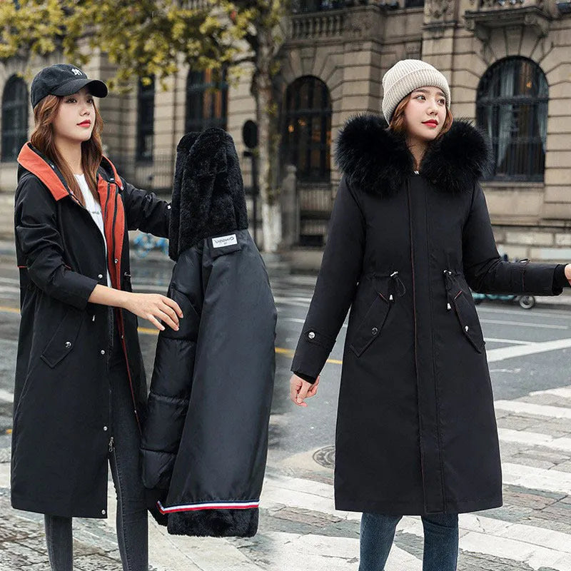 Women's long beige fleece trench coat with a belt, shown on a model.