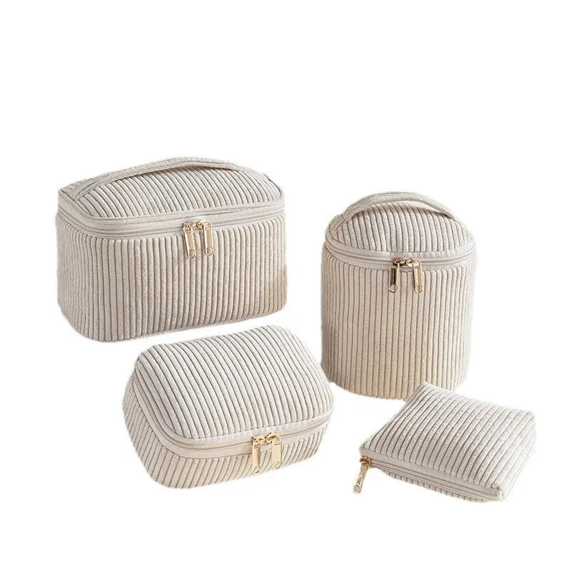 Four cube-style makeup bags in polyester material showing colour options: pink, khaki, pink dots, blue with dots