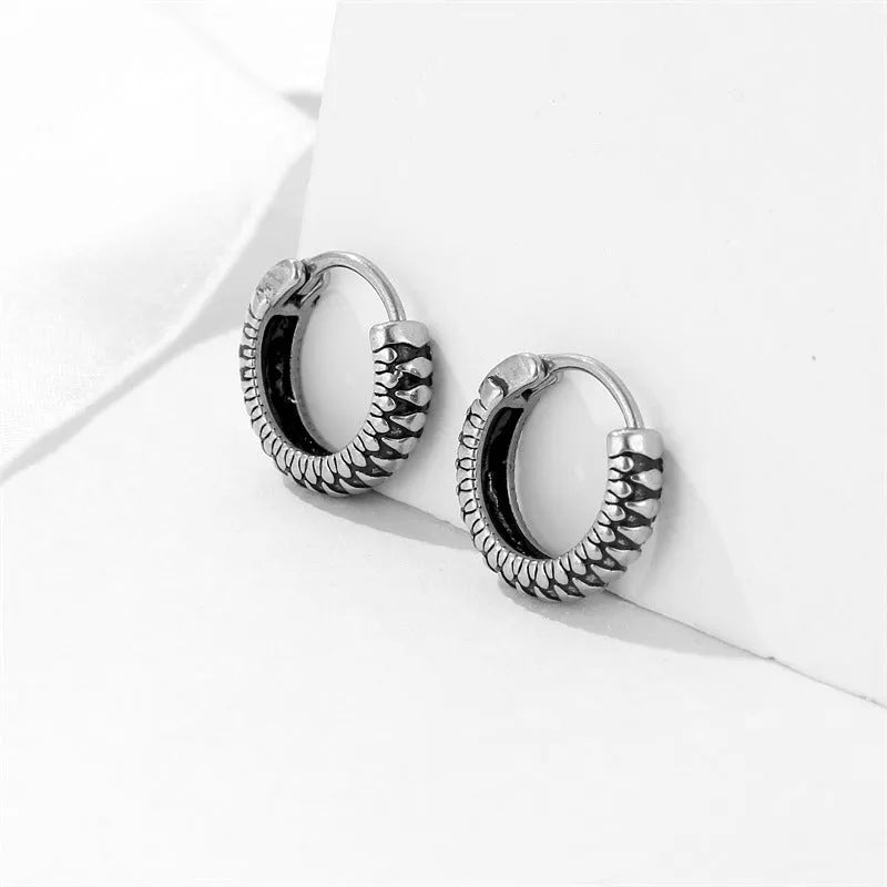 Silver geometric stud earrings with a retro striped twist pattern, made from titanium steel.