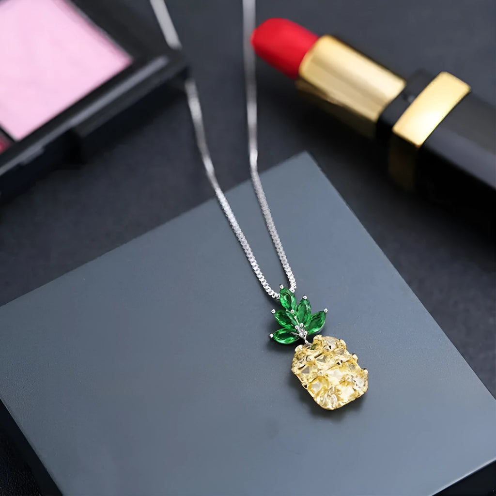 Silver pineapple charm necklace with geometric diamond design details