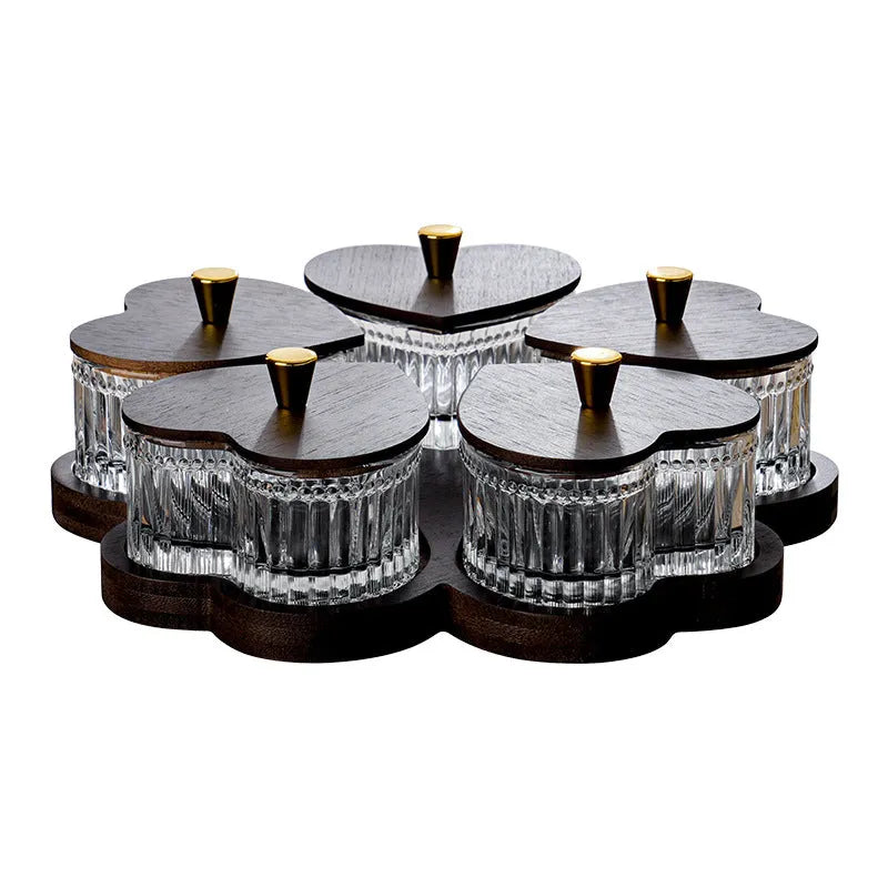 Glass retro-style snack platter with coloured glaze and a transparent heart-shaped lid over multiple compartments.