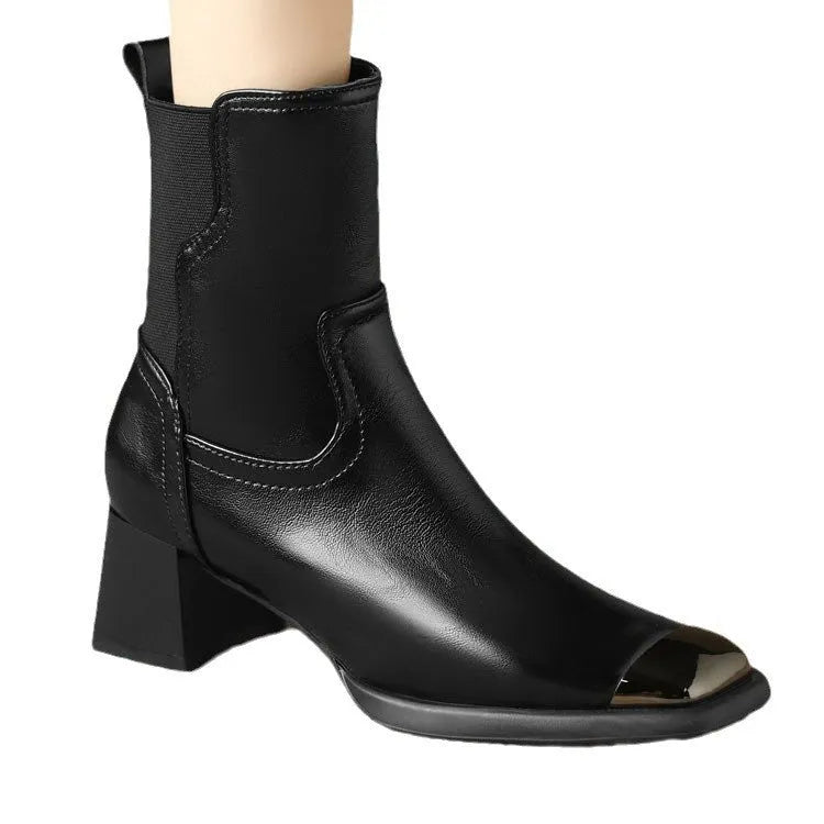 Brown women's Martin boots with side zipper and decorative metal details on a rubber sole.