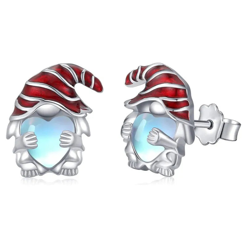 Close-up of women's heart-shaped earrings with a Santa Claus design in a white gold colour.